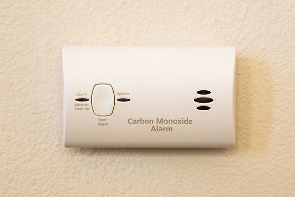 Carbon monoxide detector alarm installed in a home.