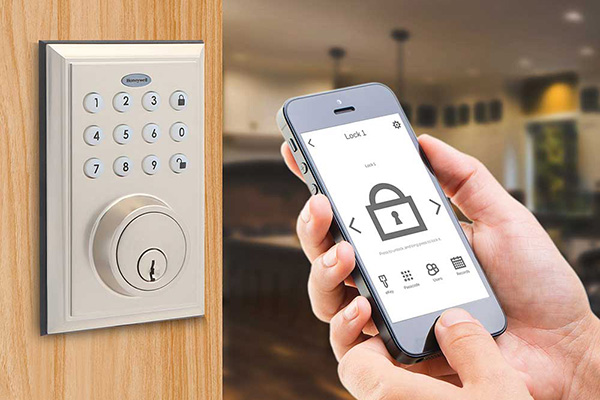 Installed automated door lock being interacted with by a customer on a smartphone.