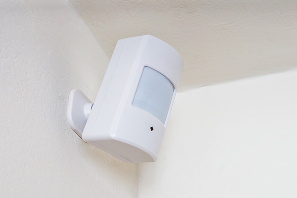 Motion detection sensor installed on the inside of a property.
