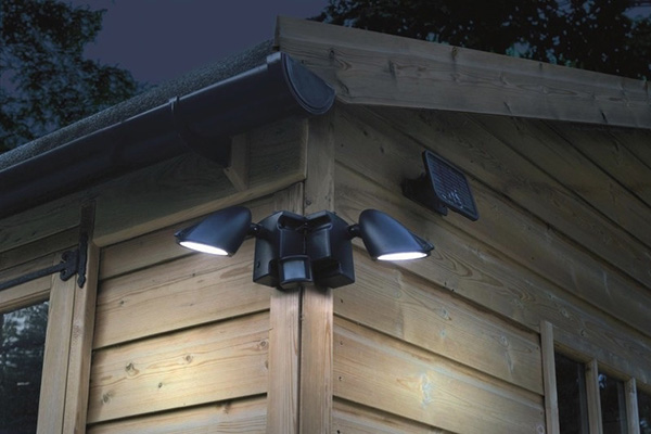 Floodlight with motion detection sensors installed on the outside of a customer's house.
